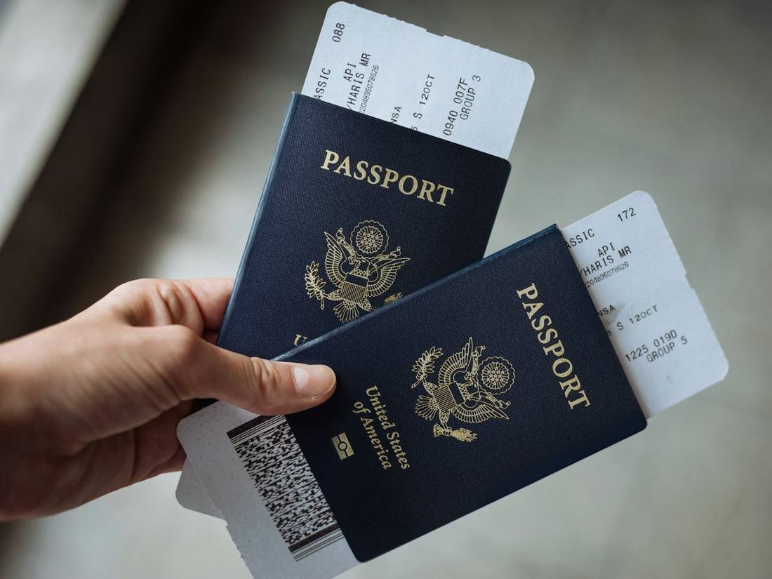 Two passports with boarding passes