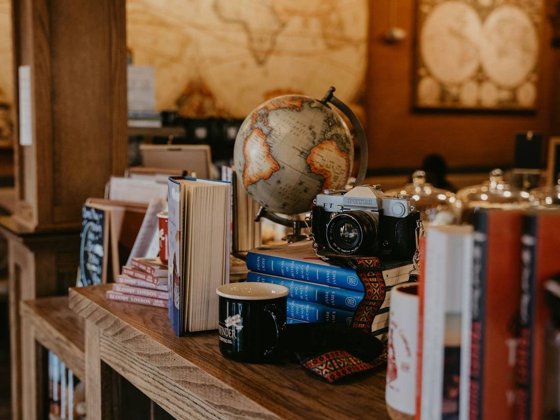 Books and a globe on a table
