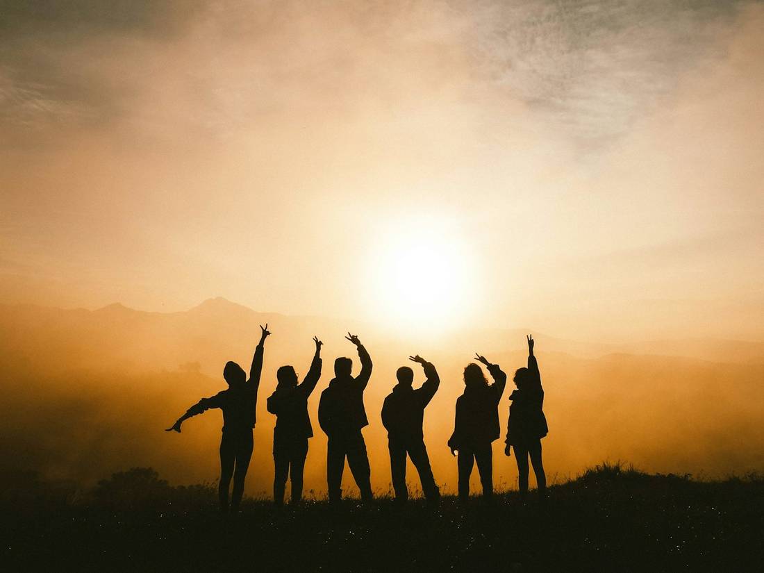 A group of six on a mountaintop