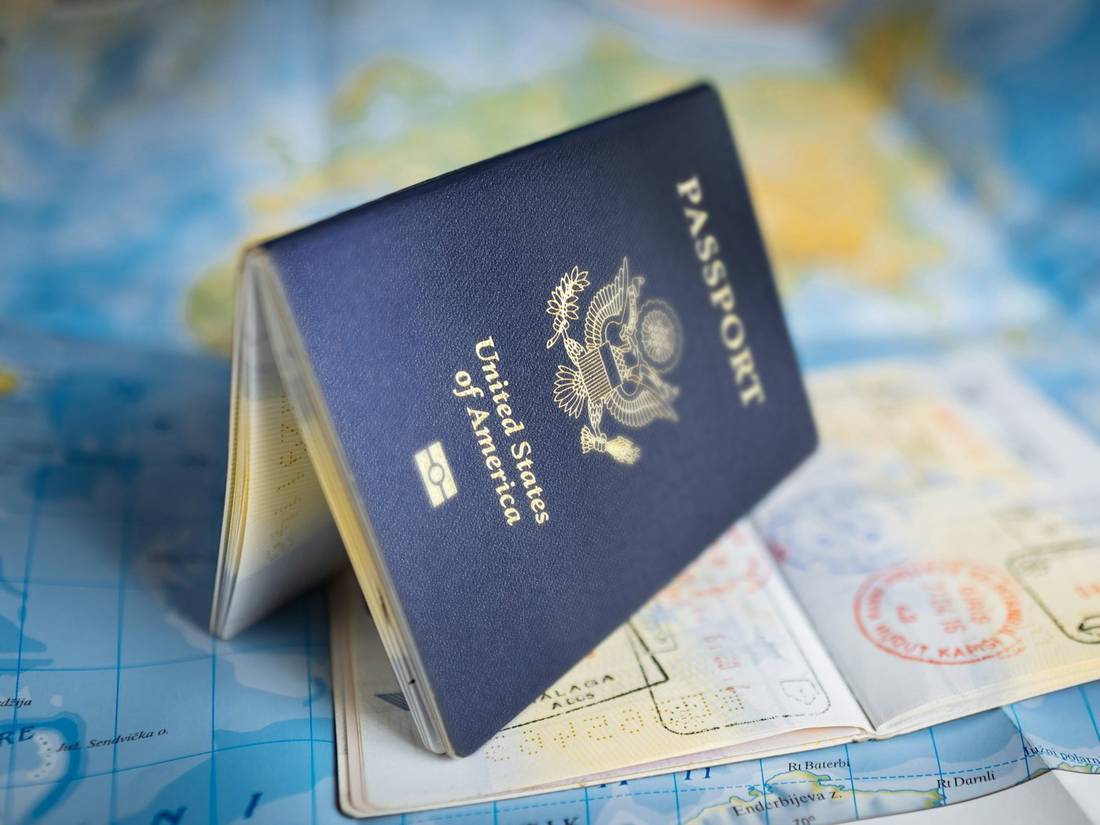 A passport open on a world map